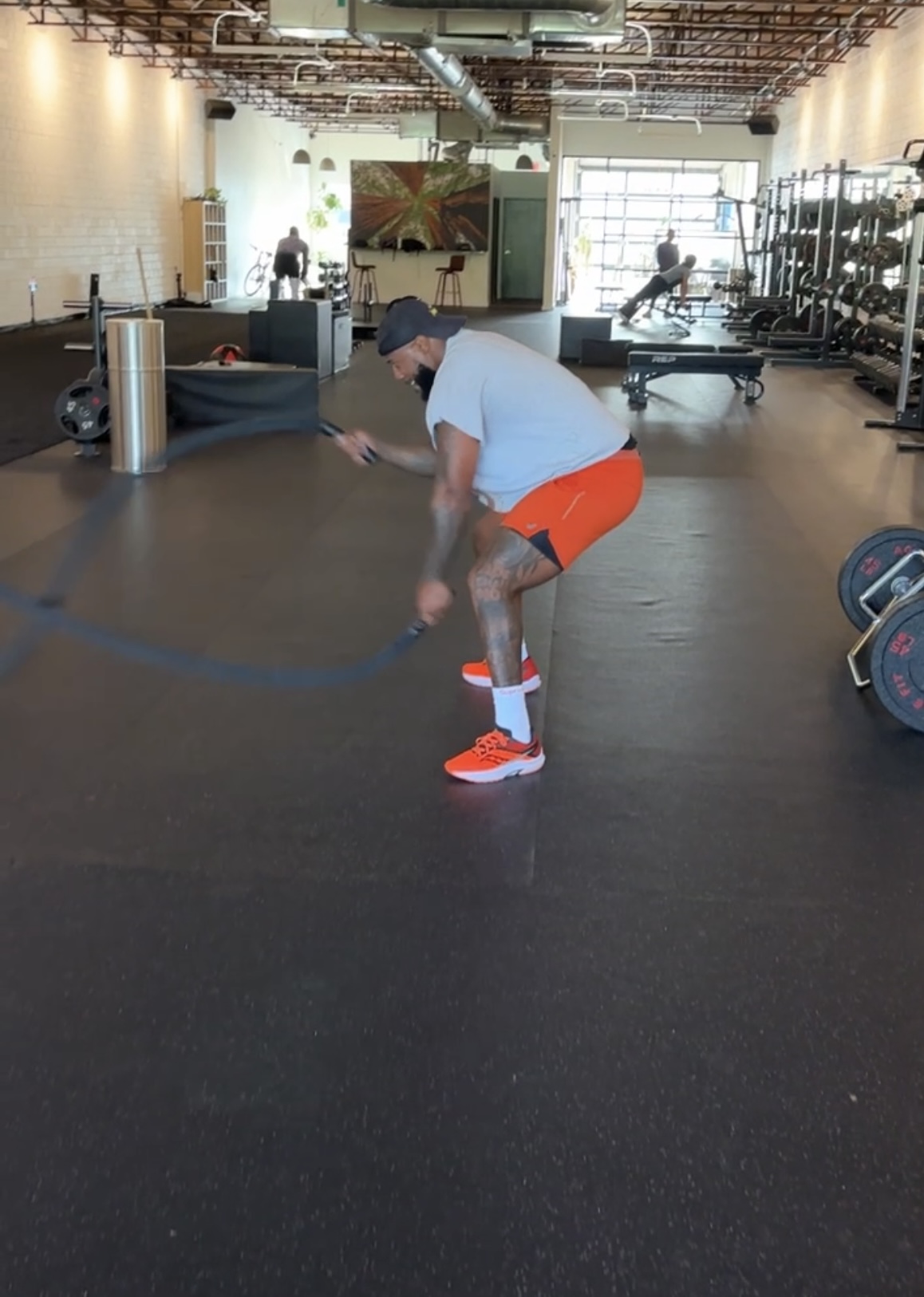 Person exercising with battle ropes